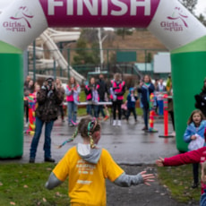 Girls on the Run participant running to the finish line.